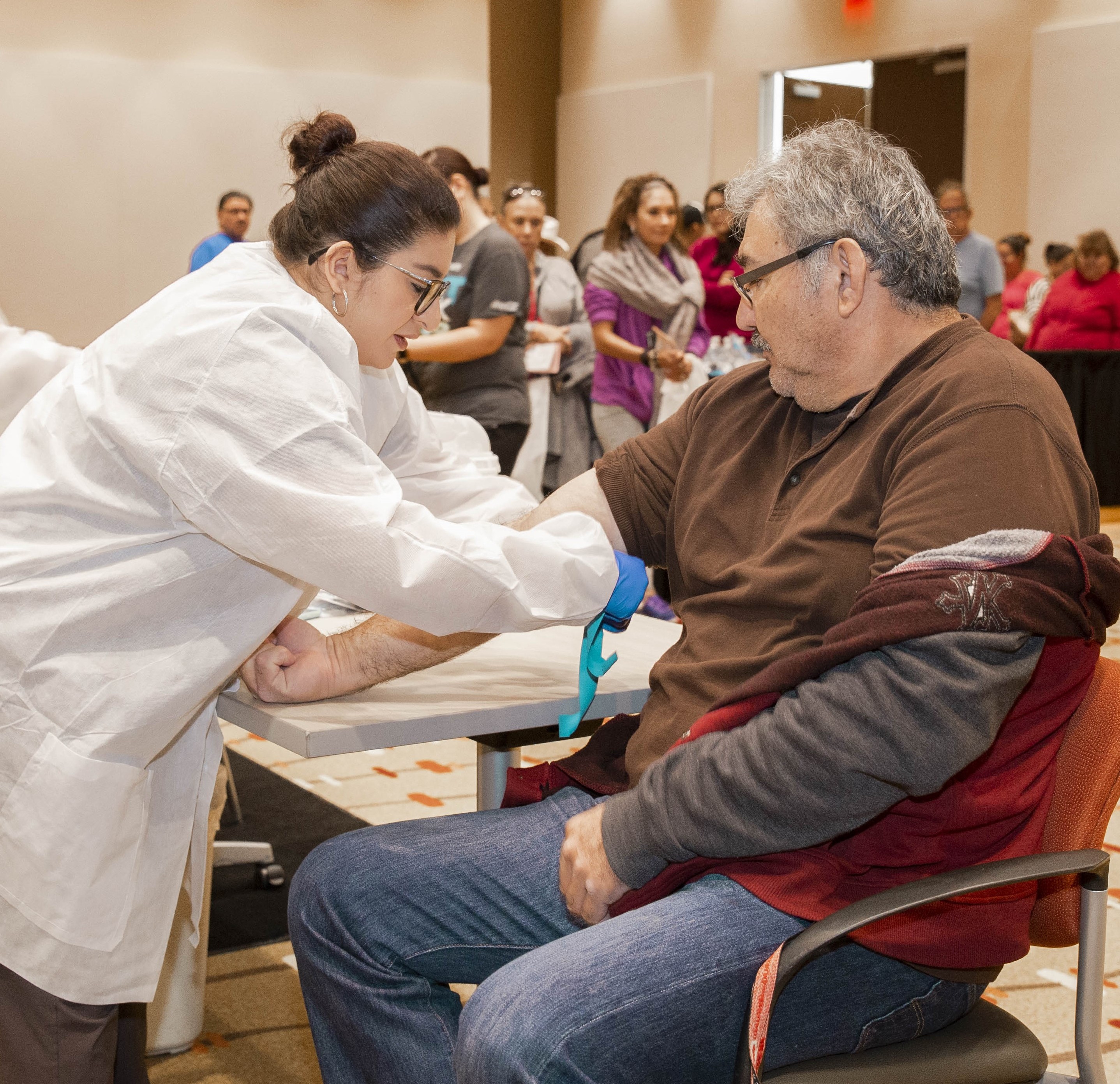 Medical Assistant Doing Screening